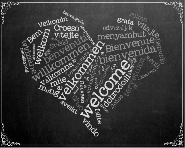 A heart made up of the word "welcome" in different languages.