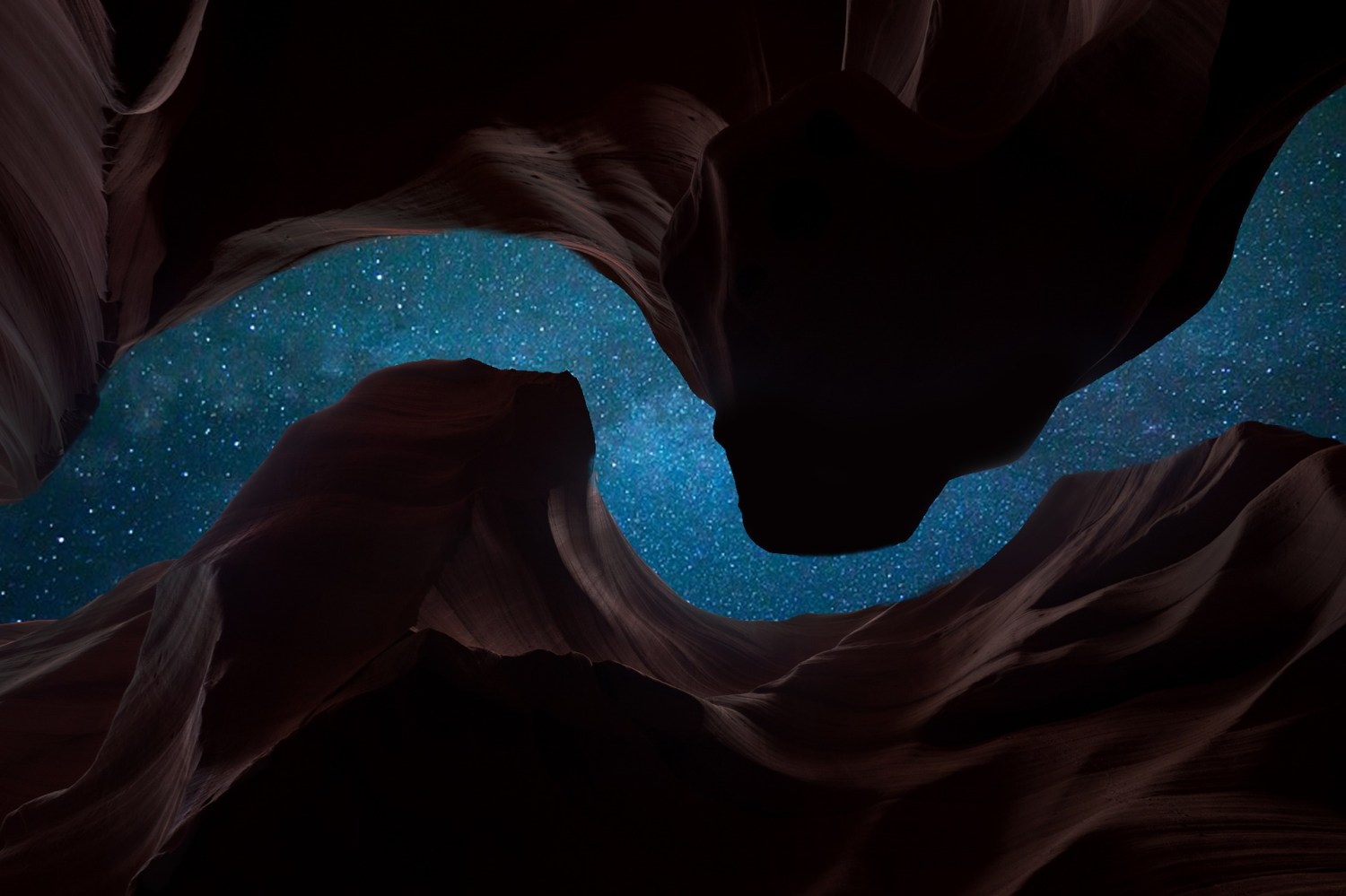 looking up at the starry night sky from the bottom of a canyon. the tops of the mountains curve around, so all you can see is an S-shaped sliver of sky